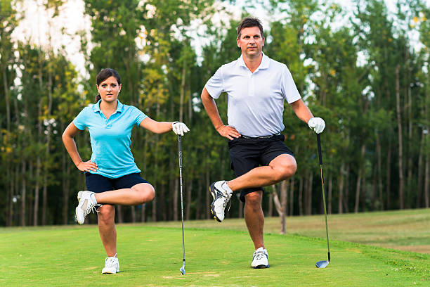 9 Easy Golf Warm-Up Routine for Beginners (Avoid Injuries & Hit Better) 7 man and woman warming before play golf