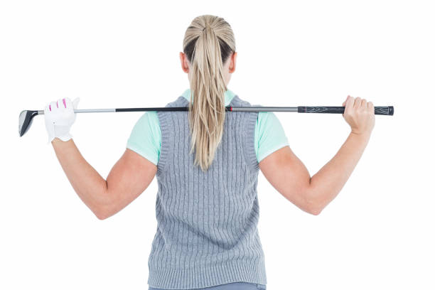 9 Easy Golf Warm-Up Routine for Beginners (Avoid Injuries & Hit Better) 4 a woman warming up before playing golf